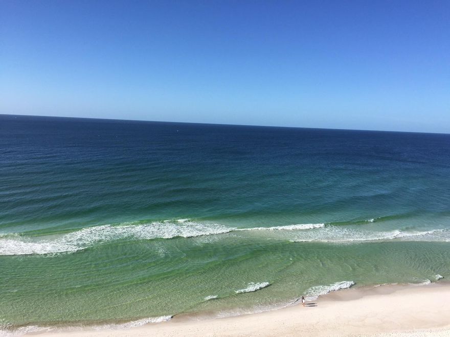 Beautiful end-unit condo on Panama City Beach. Tile floors, solid surface counter tops, large living room and windows galore! Wrap-around balcony and more! 3rd bedroom is large bunkroom.... lots of upgrades!