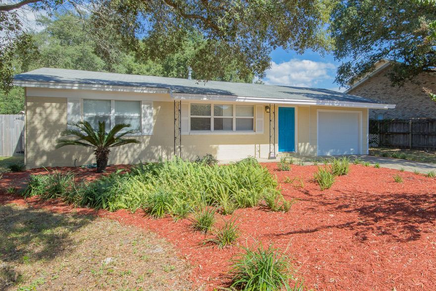 Adorable renovated 3/1 home with a 1 car garage in a great Ft Walton Beach location. Just minutes to the Santa Rosa Mall, Grocery Stores, schools, beaches, Eglin AFB & Hurlburt Field. Home has new paint inside and outside, newer laminate flooring, a recently renovated kitchen with nice maple cabinets, granite & SS appliances, newer interior doors and hardware, new lighting fixtures and fans throughout the home. Move in and start unpacking the boxes. No work to be done. Large fenced backyard with lots of room for adding a workshop or pool. Beautiful mature oak trees provide nice shade in the backyard too! This perfect starter home in a central Ft Walton Beach neighborhood will not last!