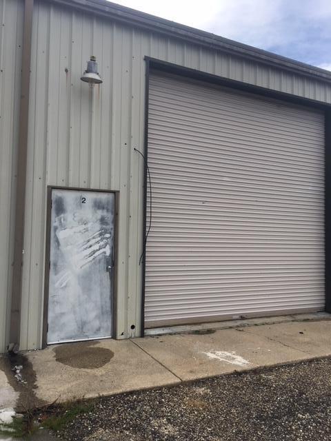 1,100 SF Warehouse space with 14 foot garage door, office space, loft area and bathroom.