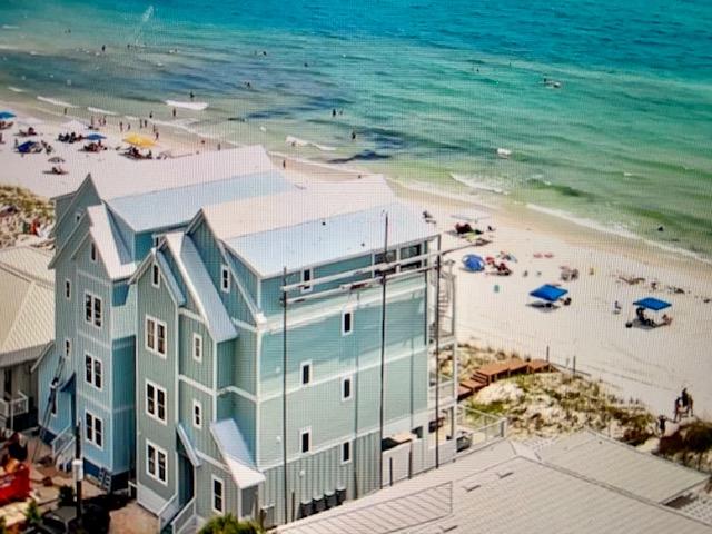 CURRENTLY UNDER CONTRACT. SELLER ACCEPTING BACK-UP OFFERS. ''Beach Happy'' is an exquisitely constructed 4-level beachfront home. This unique dream home features 8-bedrooms, 9-bathrooms, a private pool, recreational room, and open-concept kitchen/living/ dining all on the 4th floor with walkout balcony. As you first walk through your front door you will come upon the first two bedrooms, to your left is a king master suite with connected single vanity/shower bathroom and to your right is a double twin room featuring two twin over twin bunks which sleep up to 4 people; also with a connected single vanity/shower bathroom. As you keep the tour moving towards the beachside of the home you will find the quaint recreational room leading out to the private outdoor pool/spa