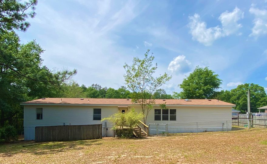 Welcome Home to 5814 Seven Ducks Lane. This ''Palm Harbor'' model stands the test of time + 2 hurricanes. This Extra large 4 bedroom/4 bathroom home is ready for a new owner. Private master bedroom has two separate baths with extra large closet. Home is very comfortable with an open floor plan to include a large living room, inviting kitchen, dining room, and family room. Three nice sized secondary bedrooms. There is also a generator for back up. The back deck overlooks a pond. Upgrades include new roof, new deck, new skirting, new chain link fence, plus maintenance done to several areas.The mobile home is a ''Palm Harbor'' top of the line. All the home inspection items have been done. It is now turnkey with most of the furniture transferring to the new owner. Carpet allowance of $2000.