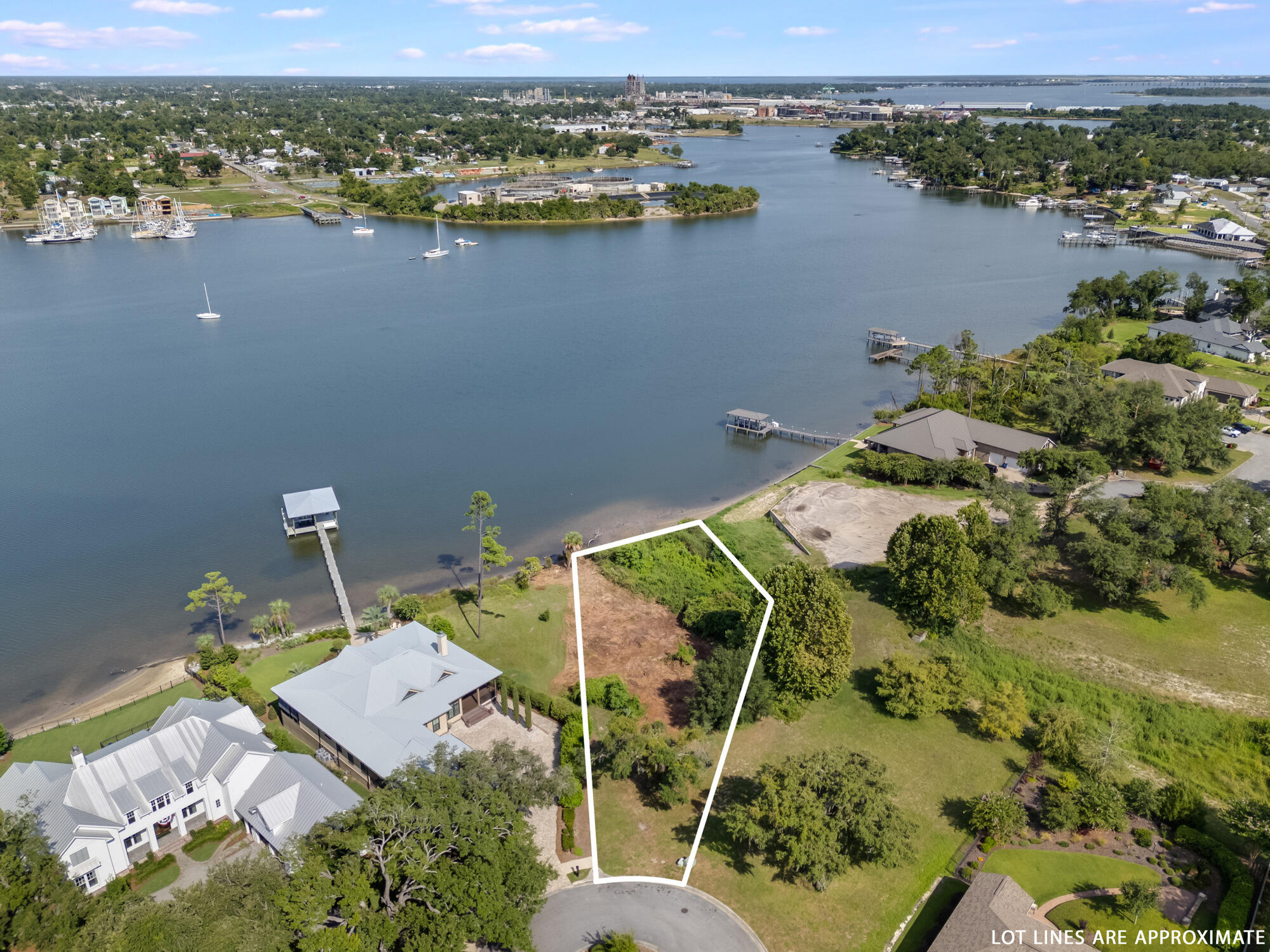 CURRENTLY UNDER CONTRACT - SELLER ACCEPTING BACK UP OFFERS. An incredible WATERFRONT opportunity to DESIGN AND BUILD YOUR OWN DREAM HOME in the highly desirable historic Cove neighborhood! Located on a cul-de-sac in Cove Pointe on beautiful Watson Bayou, this .69-acre homesite gives pure views and the ability to get from the waters of St. Andrews Bay to the open Gulf of Mexico from your back yard! With over 90' water-frontage on Watson Bayou, you'll enjoy bay breezes and privacy on your dream lot. DEP HAS GIVEN DOCK APPROVAL AND DOCK PLANS ARE INCLUDED IN THE SALE! Build your OWN DREAM HOME on this incredible waterfront lot! The Cove neighborhood provides golf cart-friendly streets, many city-maintained parks, and is home to the St. Andrews Bay Yacht Club. 

Downtown Panama City is easily accessible within 1 mile and you'll enjoy dining such as Ferrucci Italian Ristorante, Trigo San Francisco Deli and Tom's Hot Dogs. Take a stroll down the sidewalks of Downtown and stop at History Class Brewing Company or The Press Coffee Shop! All paths lead to the waters edge down the oak-tree lined streets of Harrison Avenue where you'll end at Harrison's Kitchen & Bar and the new Hotel Indigo! Downtown is booming and the place to be is THE COVE! 

Seller also has engineered building plans available for an ADDITIONAL FEE for a home that is 2,572 SF with a 2-car garage, waterfront primary suite on the main level and a grand two-story living room. The home includes 3 bedrooms, 4 baths and an unfinished bonus room providing an additional opportunity of 300 sf more living space. Buyer to verify all information.