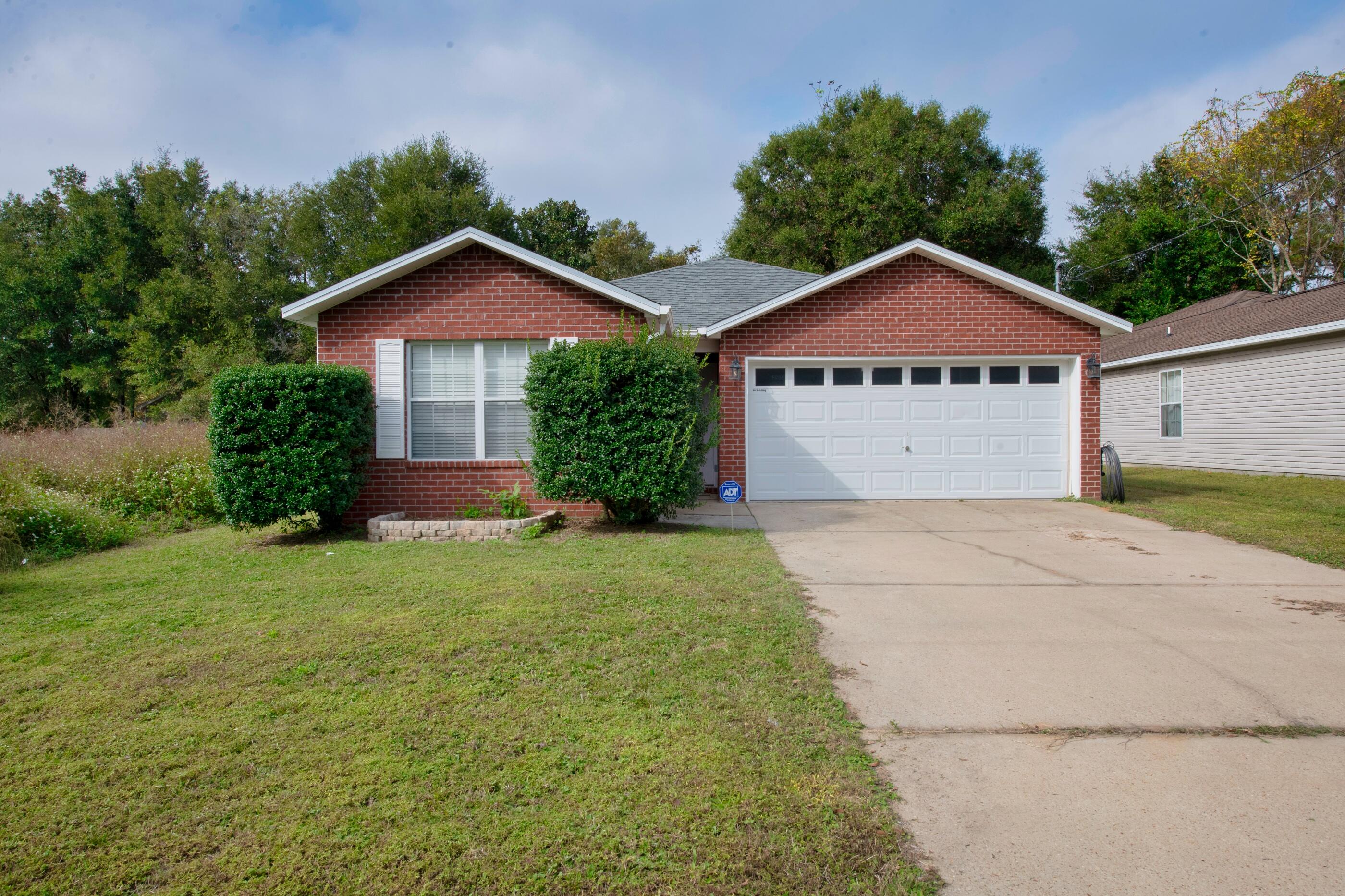 Centrally located in Crestview 3 bedroom 2 bath. This home features an open floor plan kitchen with white cabinetry, stainless steel appliances, walk in pantry, backsplash, island, separate living/dining area, primary bedroom with double vanity, shower/tub combo, and fully fenced backyard. Schedule your walkthrough today!
