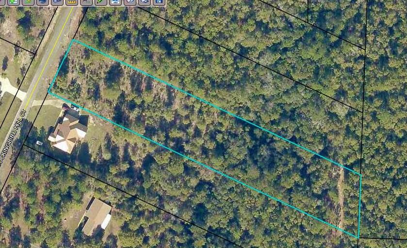 Well priced creekfront 2+ acre wooded lot in Poverty Creek area. Very gentle slope to the water.