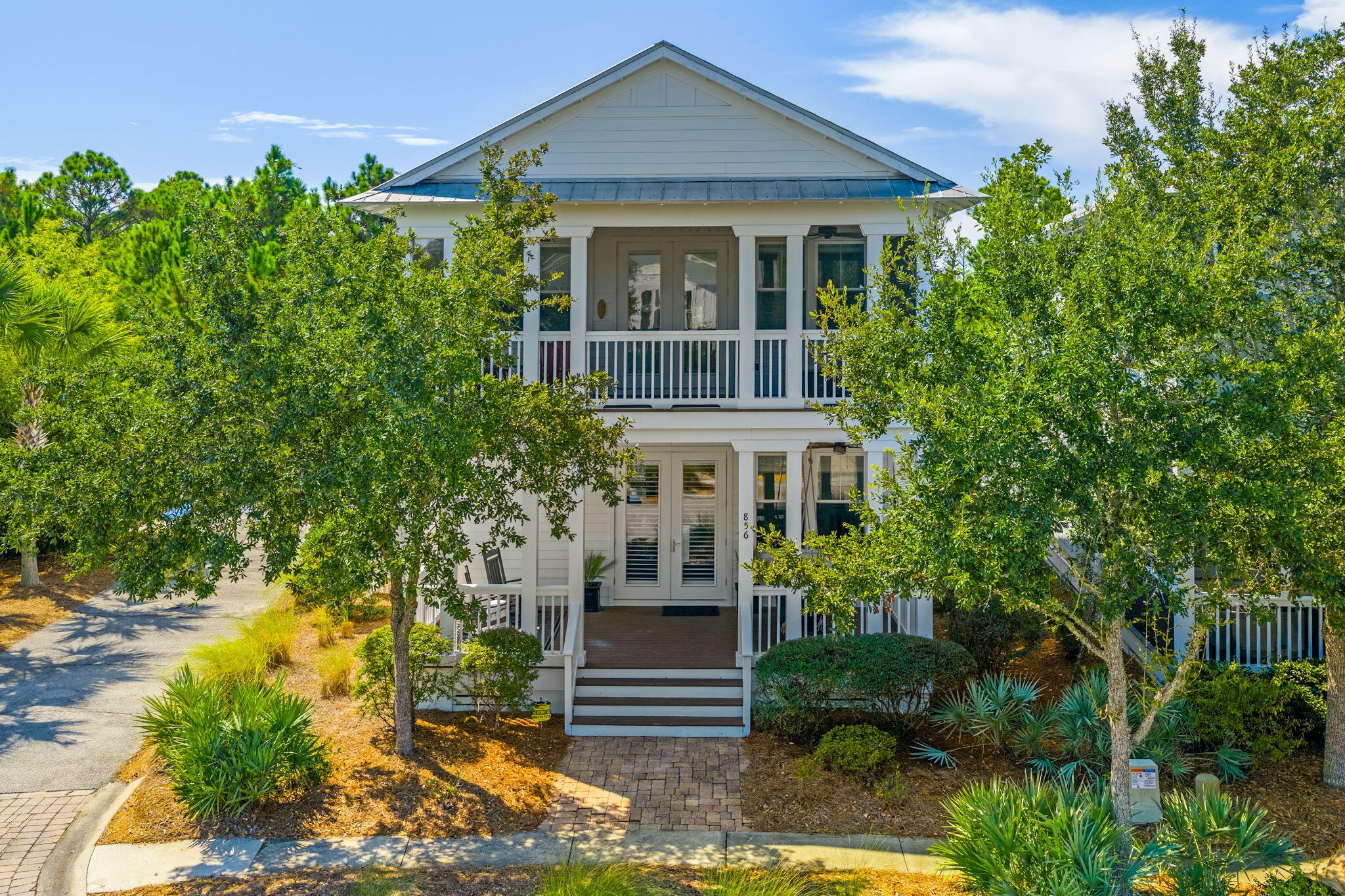 Prime Location Near the Pool | Beautiful Community Views | Spacious and Upgraded Home. Offered fully furnished, this exceptional Sea Breeze model offers unmatched convenience. Located directly across from the Gathering Place and playground, with quick access to the beach trail and stunning views of ponds and boardwalks from nearly every window.Highlights include three covered porches (two screened), solid pine floors, designer fixtures, plantation shutters, and window treatments. The open floor plan features shiplap accents, a modern kitchen with GE gas range, upgraded shaker cabinets, backsplash, large island, and under-cabinet lighting. The first floor includes the first of two master suites and a versatile heated/cooled storage closet ideal for bikes and beach gear.
Upstairs, enjoy a spacious loft (that includes a Murphy Bed) with a screened porch overlooking the pool and playground. The large master suite boasts a super-sized closet with organization fixtures, while additional bedrooms, including a bunk room, make this ideal for family and guests. Rental projections are excellent due to its prime location in NatureWalk, the premier community on 30A with amenities such as three resort-style pools, pickleball and basketball courts, playground, and scenic walking trails throughout the neighborhood and forest. Just a short bike ride to Seaside, Watercolor, and the beach.
Whether you're seeking a permanent residence, vacation home, or investment opportunity, this property delivers the perfect blend of comfort, style, and location.