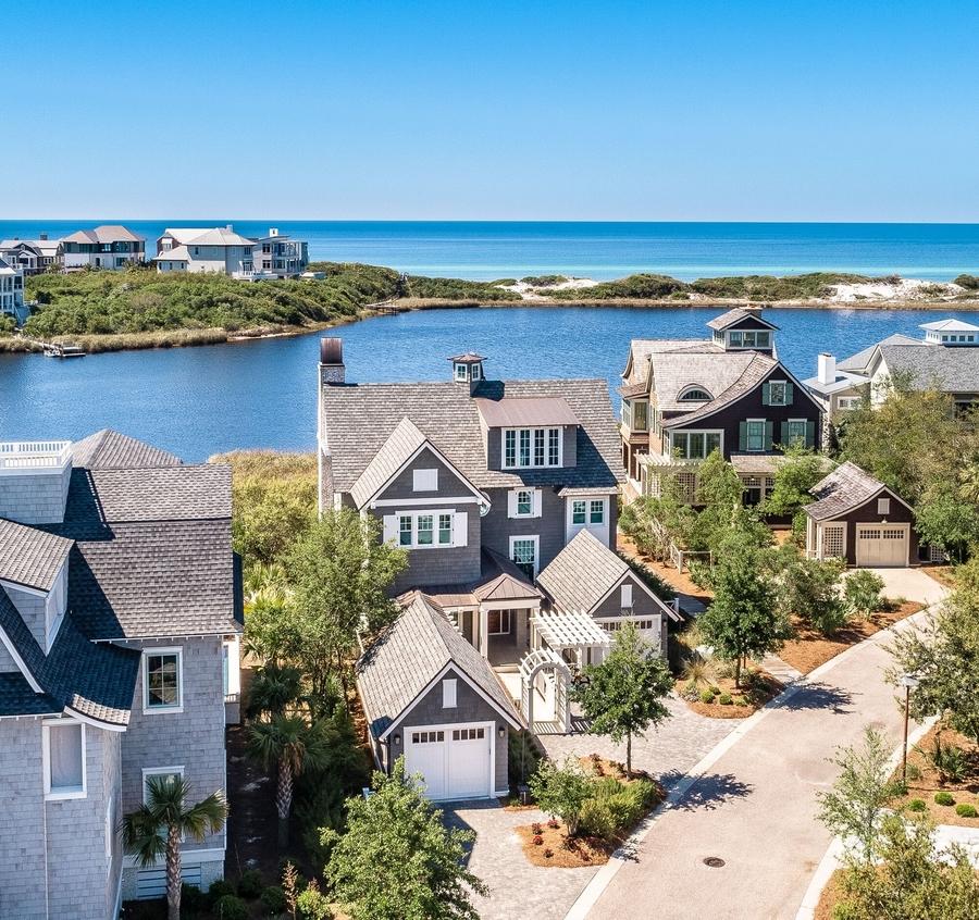 With panoramic views of a Coastal Dune Lake and the Gulf of Mexico, this exquisite lakefront home designed by TS Adams Studio is a rare find. Completed in September 2016, this like-new home has an elevator, pool, spa and four private porches. Bespoke interiors by Darci Hether NY create a sophisticated yet comfortable living experience for those who appreciate quality. Perfectly situated on one of 30A's prime lots, with five bedrooms (one finished as an office), 5.5 baths with high-end finishes throughout, privacy and views galore  this is a dream beach home. Watersound Beach is a gated community offering one-mile of beachfront for residents. Kayaking and paddle boarding and the beach are steps from this home on the exclusive gated Watersound Peninsula.