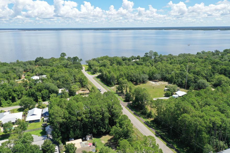 Zoned both Residential and Neighborhood Commercial! Site plans with confirmed setbacks/buffers from Walton Co Planning Department are available. Neighborhood Commercial designation has a variety of uses ranging from offices, retail, or live/work to a restaurant, small scale grocery, or bed & breakfast. A commercial concept would have to go through the standard minor development order process. A residential home would be the normal building permit process. This 75x150 (.26 acre) vacant lot is wooded with beautiful mature pine trees and magnolias. There has been a survey and wetland delineation - showing 100% of the property is uplands and flood zone x (no flood insurance required). Just a 5 minute drive to Grayton beach and Hwy 30A.