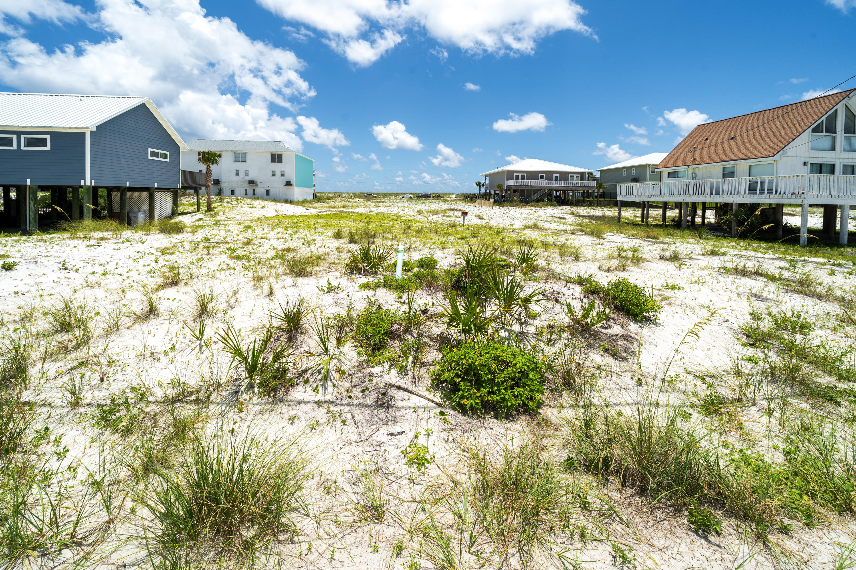 Build your dream home in Navarre Beach on White Sands Boulevard and capture views of the canal. The public beach parking and access is just a short stroll or a quick bike ride. Live a laid-back coastal lifestyle and enjoy the good life in Navarre Beach. Design your weekend retreat or personal home from the top down to take advantage of the opportunity to build to today's construction codes and standards as well as your family's lifestyle. For the adventurous, enjoy excursions as Navarre Beach is nestled perfectly between Destin and Pensacola for brief pleasure trips to discover some of the finest in casual and fine dining, shopping and entertainment on the Emerald Coast. The Navarre Beach Pier, the longest pier on the Gulf coast, is nearby where you can enjoy fishing, boat watching, or gazing at the views of the Gulf Islands National Seashore. Eight miles of undeveloped pristine shoreline beckon you to walk the beach and we invite you to learn more about the exciting opportunity to build your dream home in Navarre Beach.