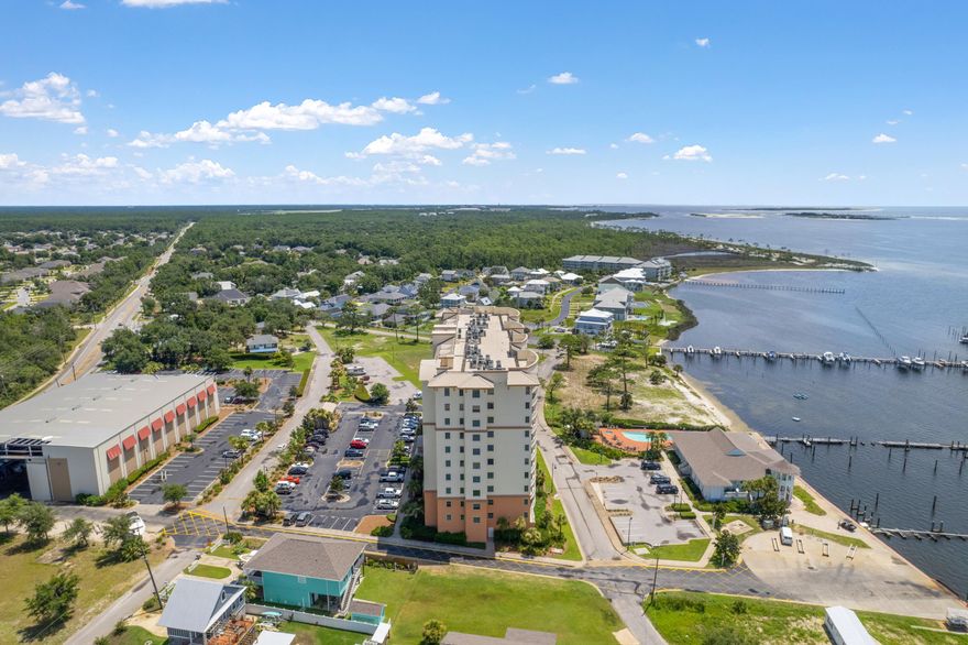 This exceptional 2-bedroom + BONUS ROOM condo, located on the 10TH FLOOR, offers a prime location perched alongside the Intracoastal Waterway. With stunning water views encompassing the Intracoastal waterway and extending over Perdido Key to the Gulf of Mexico, the private and spacious balcony is an ideal spot for hosting gatherings with family and friends, whether you're watching the mesmerizing performances of the Blue Angels or simply admiring the picturesque marina setting. Inside, this residence features a generously-sized floor plan, complete with a well-appointed kitchen and a master bedroom that is both spacious and luxurious. Many attributes make this condo the ideal spot for condo living including a BRAND NEW HVAC SYSTEM, modern appliances, solid wood cabinets and doors, high ce