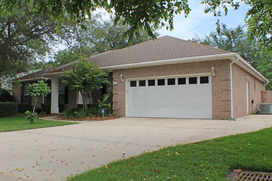 As you approach this home you are greeted by a covered front porch. Through the front door is a small foyer opening up to your dining room on the right. To your left is a bedroom/office with a half bath. The floor plan opens up to your living room complete with a fireplace and French doors leading out to your enclosed porch, fenced-in backyard, and in-ground pool. The kitchen has room for a breakfast nook, and the breakfast bar providing plenty of cabinet and countertop space - perfect for entertaining. Through the kitchen and past the dining room is your massive master suite. The master bathroom has a walk-in closet, double vanity sinks, and garden tub with separate shower. Back through the living room on the other wing of the home is your full hall bathroom and three additional bedrooms.