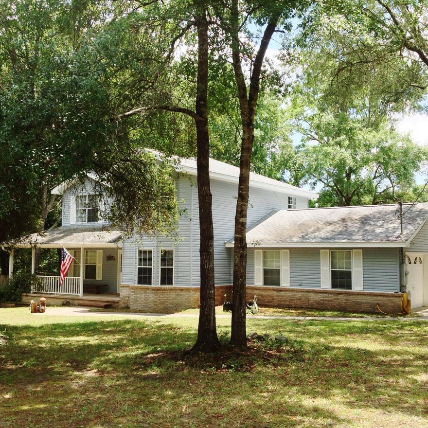 MOVE IN READY! BRING ALL OFFERS! Private, Country Charm South of I-10! Nestled on a double lot, nearly 3/4th's of an acre! Surrounded by a white picket fence. The wrap around front porch invites you to sip sweet tea while swinging amongst the sweet smell of jasmine. Tiled entry brings you to the formal dining room on the right, complete with bay windows, and office to the left. Living room features wood floors and wood burning, river rock fireplace. There's another office/media room just off the Living room. The large kitchen offers beautiful wood cabinets, breakfast bar, smooth top stove, and a bay windowed breakfast nook. Upstairs, a loft leads to 2 additional bedrooms and full bath. Master suite has bay windowed sitting area, walk in closet and Incredible