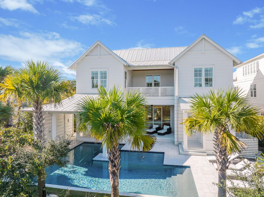 Located in the iconic Blue Mountain Beach, this over the top home is perfect for a residential home, 2nd home or vacation rental. The outdoor living is exemplified by an oversized, heated pool that features a swim up bar, sun shelf, cabana, and outdoor fireplace. Outdoors also includes a gas grill, ice maker, TV, and fridge. Inside, the main floor is highlighted by the gourmet kitchen and spacious living room, which features 12 foot ceilings, shiplap, and rustic beams. The spacious bedrooms each feature their own en suite bathrooms, as well as sizable closet space. The large built-in bunk room area is perfect for adults or kids. If that isn't enough, there is a mother-in-law suite above the garage with it's own kitchen, full bath and living area. This is definitely one to see.