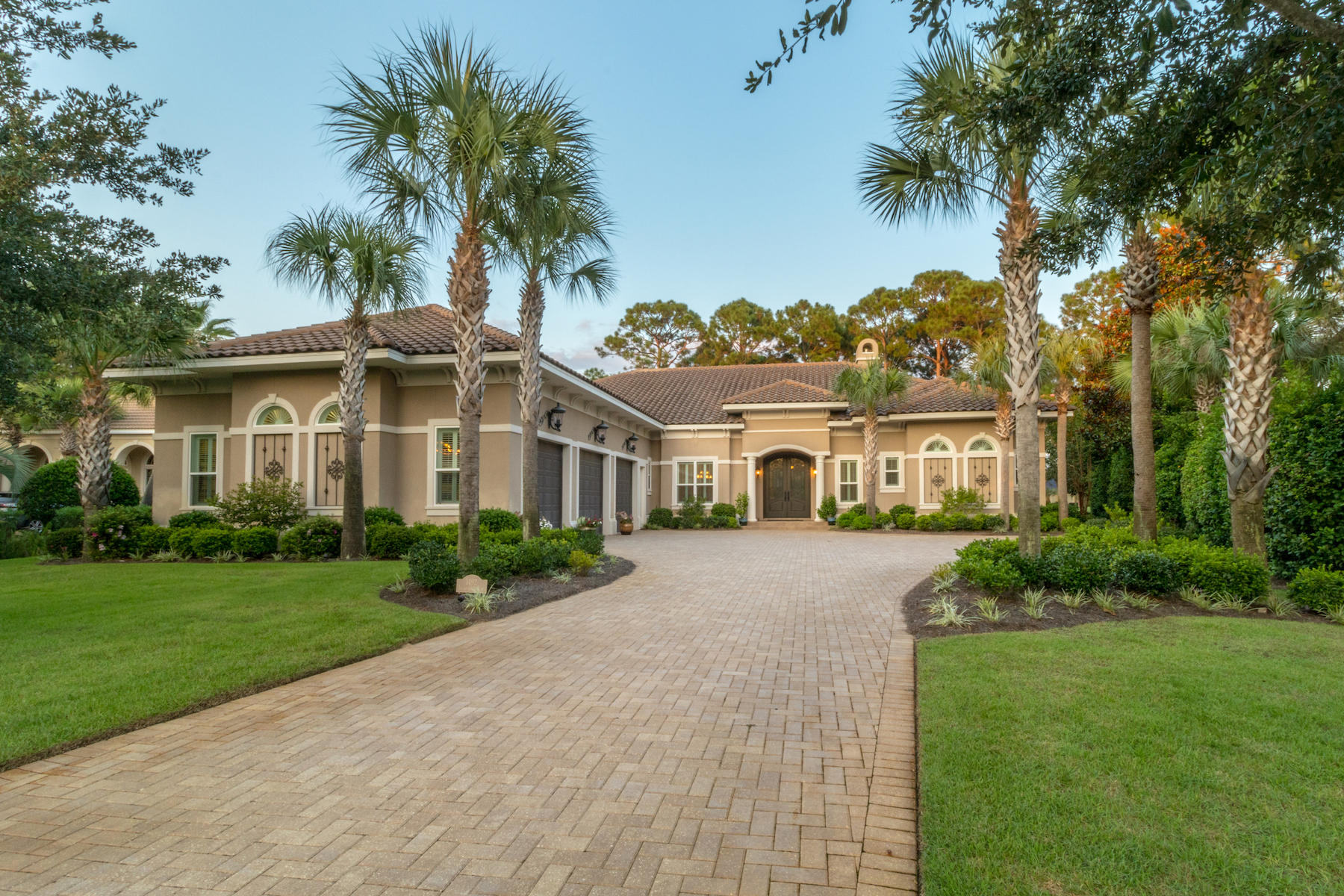 Welcome to your DREAM! A 6,130 sq. ft. custom-built luxury estate located within the prestigious Island Green community. Beauty & elegance exudes from the professionally manicured curb appeal to the luxury interior finishes. As you enter through the double arched wood doors, you are greeted with a front living room with large, 5 pane curved windows showcasing the in-ground salt water pool with spa & waterfall, screened lanai, luxury summer kitchen with fireplace, and the 16th fairway of Raven Golf Course. Entertaining is a delight with the stately Chef's kitchen including a double oven, new gas burner stove (2016), custom cabinets, huge island and breakfast bar. In addition, off the kitchen is a separate wet bar equipped with a wine refrigerator, 2-unit refrigerator and extra storage.