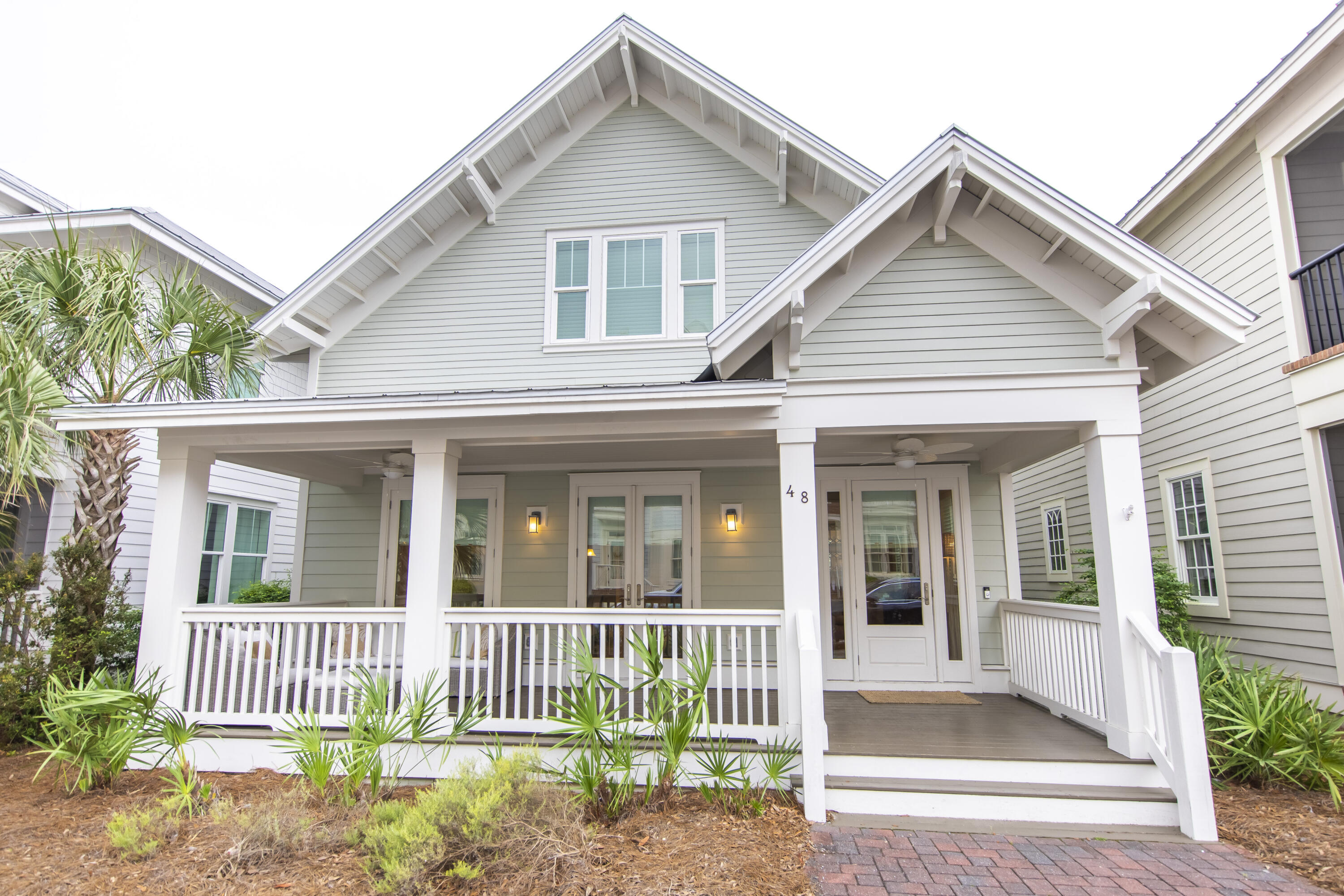 Highly desirable ''Capri Plan', turnkey with over $70,000 in rental projections, located south of 30A in Prominence. This stunning beach cottage is professionally designed and offered fully furnished. The property comfortably sleeps 12 and features (3) full bedrooms, a bunk room with (4) built-in bunks, (3.5) baths, and a detached (2) car garage. The bunk room can easily be converted into a full 4th bedroom. Features include: 10ft-12ft ceilings, 8ft shaker style doors, professional designed lighting, coastal wood flooring, central vac, integrated pot filler in kitchen, epoxy coated garage floor, new paint (2018), new HVAC systems (2018), washer/dryer, 2 covered porches, and an outdoor shower. The kitchen is a chef's dream with stainless steel appliances, expansive cabinetry, granite MORE