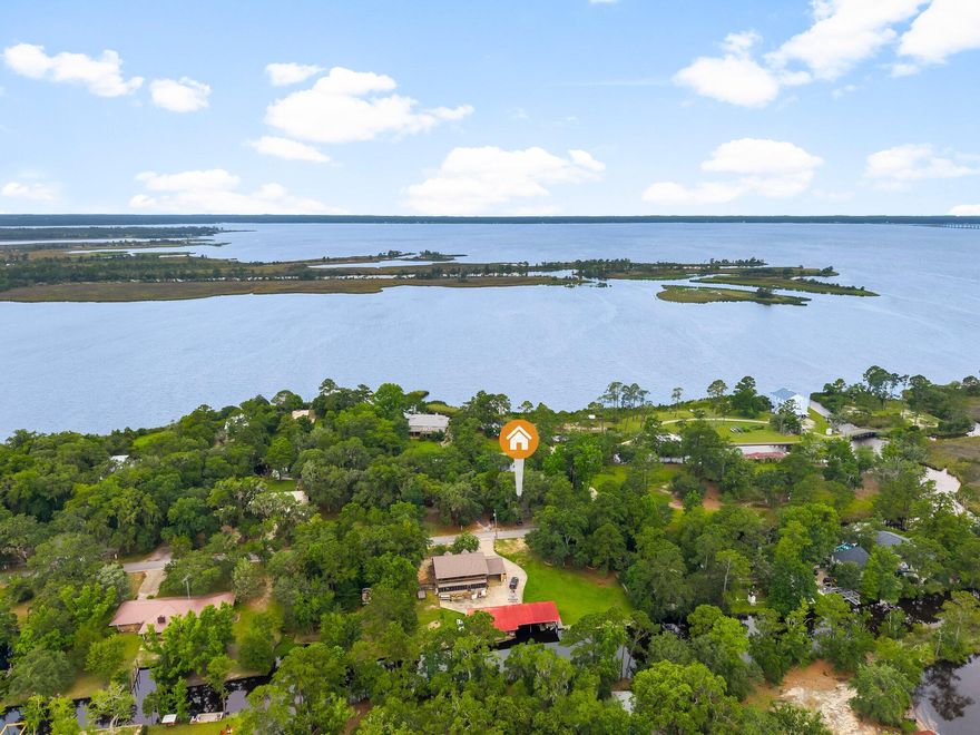 Breathtaking WATERFRONT PROPERTY! This one of a kind bay front property has not been on the market for over 50 years. It has been meticulously cared for and updated over that time. The home sits on a canal front .34 acre lot and includes a second lot on Jolly Bay, measuring .33 acres, bringing the total lot area to approximately .67 acres. Walking through the front door you find a spacious open-concept dining area and living room. Central to this space is a beautiful custom built mantel and wood burning fireplace. Looking out back you are greeted with views of the bay over your private in-ground pool and screened in porch, perfect for sitting and enjoying the summer days. There are two bedrooms on the east side of the home that share a hallway bathroom. The master bedroom is separated on the west side of the home and provides privacy, a view of the bay and an ensuite bathroom with walk in shower. It also features a unique walk in closet area with its own custom built vanity, sink and mirror. 
The kitchen is located at the front of the house and provides ample counter and cabinet space for all your family and entertaining needs. Just off the kitchen is a nicely done closed in garage/sunroom that provides a generous flex space for many possible uses. The covered carport gives you a weather free entry to the house and also features a workshop with ample room for storage or any hobby that you may need indoor space to accomplish.
The best part of it all, you're on the water and have your own personal access to Jolly Bay, Choctawhatchee Bay, The Gulf and anything beyond! The beaches of 30A are only a 15 minute drive and jump on your boat for a short ride to great dining, to include The Bay, North Beach/Farm and Fire, Nick's Seafood and more! Come take a look at this legacy property and imagine yourself living the "Old Florida" lifestyle of your dreams!