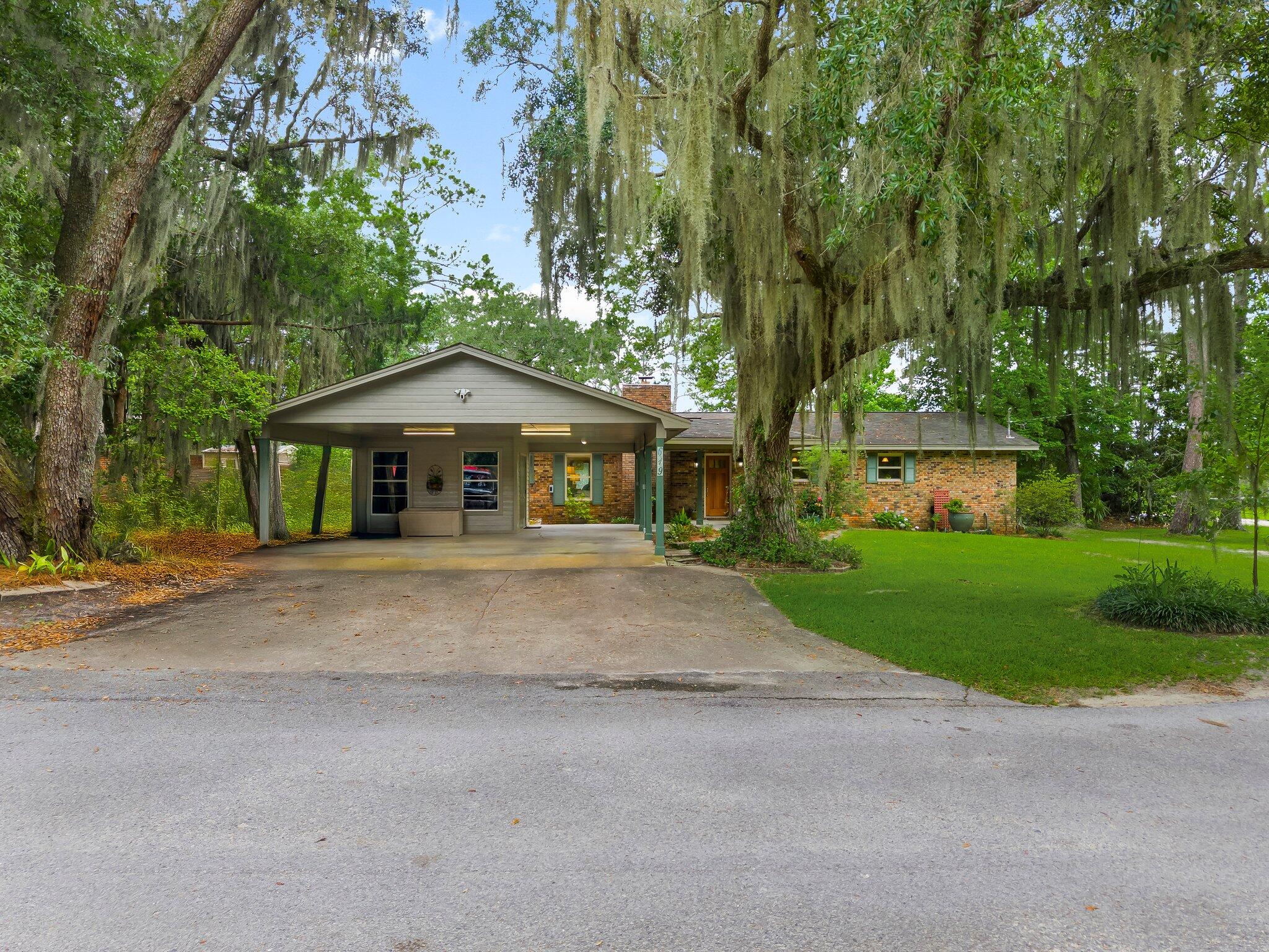 Breathtaking WATERFRONT PROPERTY! This one of a kind bay front property has belonged to the same family for over 50 years. It has been meticulously cared for and updated over that time. The home sits on a canal front .34 acre lot and includes a second lot on Jolly Bay, measuring .33 acres, bringing the total lot area to approximately .67 acres. Walking through the front door you find a spacious open-concept dining area and living room. Central to this space is a beautiful custom built mantel and wood burning fireplace. Looking out back you are greeted with views of the bay over your private in-ground pool and screened in porch, perfect for sitting and enjoying the summer days. There are two bedrooms on the east side of the home that share a hallway bathroom. The master bedroom is separated on the west side of the home and provides privacy, a view of the bay and an ensuite bathroom with walk in shower. It also features a unique walk in closet area with its own custom built vanity, sink and mirror.
The galley kitchen is located at the front of the house and provides ample counter and cabinet space for all your family and entertaining needs. The laundry space is located off the far end of the kitchen for easy access. Just off the kitchen is a nicely done closed in garage/sunroom that provides a generous flex space for many possible uses. The covered carport gives you a weather free entry to the house and also features a workshop with ample room for storage or any hobby that you may need indoor space to accomplish.
The best part of it all, you're on the water and have your own personal access to Jolly Bay, Choctawhatchee Bay, The Gulf and anything beyond! Come take a look at this legacy property and imagine yourself living the "Old Florida" lifestyle of your dreams!