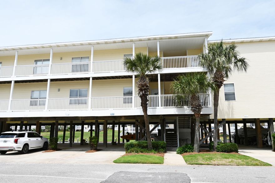 Bring your boat and park your trailer under your unit!  Brand NEW A/C, replaced in July 2023.  Sandpiper Cove is located in the beautiful Destin, FL.  This two bedroom, two bathroom home is situated on a canal with views of the harbor. Imagine sitting in your living room day or night and taking in the postcard-worthy views. Bring your boat and take advantage of easy access to the warm Gulf waters for days of adventure! Enjoy all that Florida has to offer right outside your door.