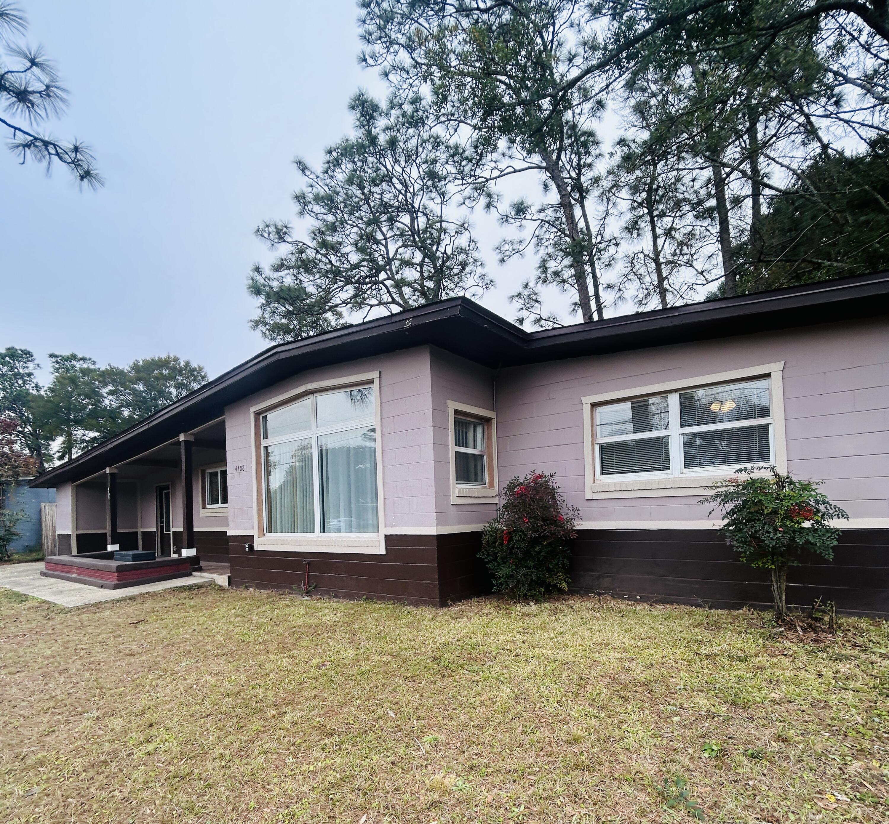 Mid-Century Modern Ranch-Style Home Awaits!As you enter, large windows fill the open floor plan with natural light, creating a bright and inviting atmosphere that seamlessly connects indoor and outdoor living.This 3-bedroom, 1.5-bathroom Mid-Century Modern ranch-style home offers comfort, functionality, and recent updates. The oversized bonus room, formerly an enclosed carport, features a mini-split heating and air system, a large closet, and indoor laundry--perfect for a home office, playroom, or additional living space.With updates including a new roof (2022), HVAC (2023), and water heater (2022), this home is move-in ready. The newly fenced backyard adds privacy, making it ideal for relaxing or entertaining.Conveniently located in Pensacola, it's just minutes from Gu