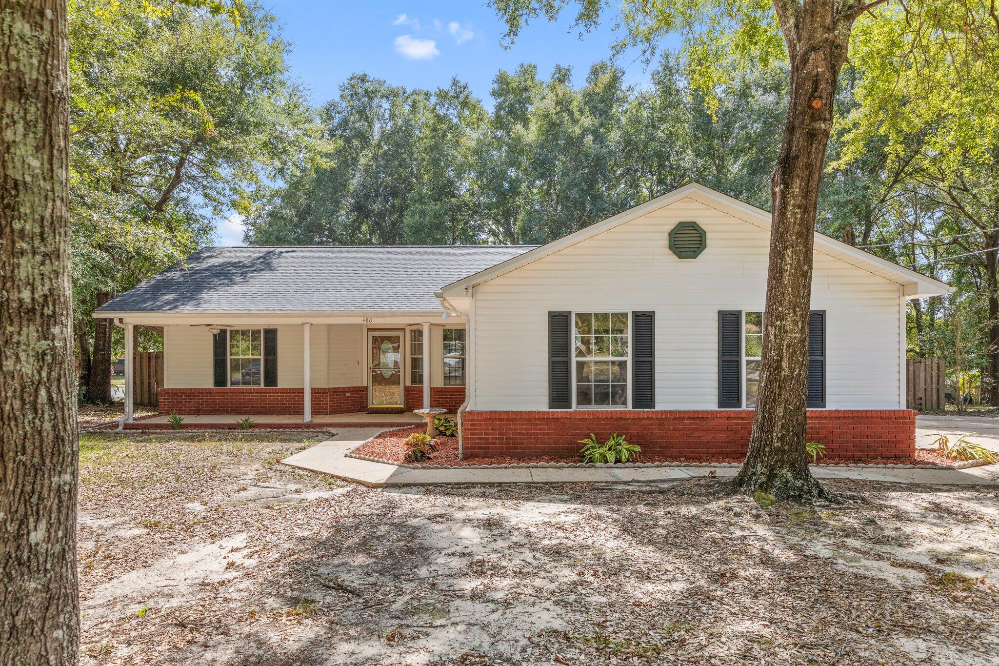 Beautiful corner lot home with plenty of space to relax. LVP and tile flooring meet you as you enter the spacious main living area and continue through all four bedrooms in this 4bd/2ba home. The open kitchen complete with stainless steel appliances provides ease to prepare as you entertain guests. Modern vanities and fixtures add classic touches in both bathrooms. A grand primary bedroom complete with tray ceilings and an ensuite bath invite privacy and an open feel. The converted garage offers options for a bedroom, office, playroom, or storage with tile floors and a large closet. The Florida room boasts large windows allowing for lots of natural light and leads out to a patio perfect for entertaining with both open and covered areas. Move in ready with a great location!
