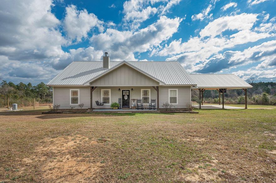 Looking for move in ready perfect country home - this one has everything! Located just outside of Florala, this home sits on 18 amazing acres and offers 3 bedrooms, 2 and 1/2 baths with an open living room and kitchen/dining combo. Kitchen offers all the pluses to include breakfast bar, top of line appliances and a great pantry. The master suite offers easy access to laundry room, has tons of privacy and a master bath with his-her closest along with tile shower and floating tub that leaves nothing to desire. The home includes a 714 upstairs bonus room that is perfect for entertaining. Home has tons of built-ins and personal touches that make cozy an understatement. No detail has been left out include corner wood burning fireplace, large covered front and salt water pool.