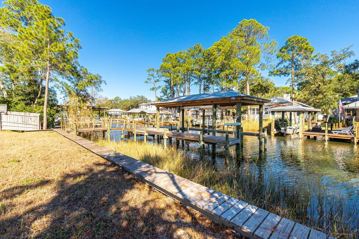 Spectacular opportunities await the boating aficionado with this 75 foot wide Canal front home site with seawall protection, boat dock and a 13,000 lb. lift. Mature oak and magnolia trees greet you and offer privacy while the remainder of the lot has been cleared and tap fees paid. Enjoy the coveted South Walton lifestyle at this highly desirable location within a short distance to restaurants, shopping, and Sacred Heart Hospital. Quick and easy access to the Choctawhatchee Bay in your boat.