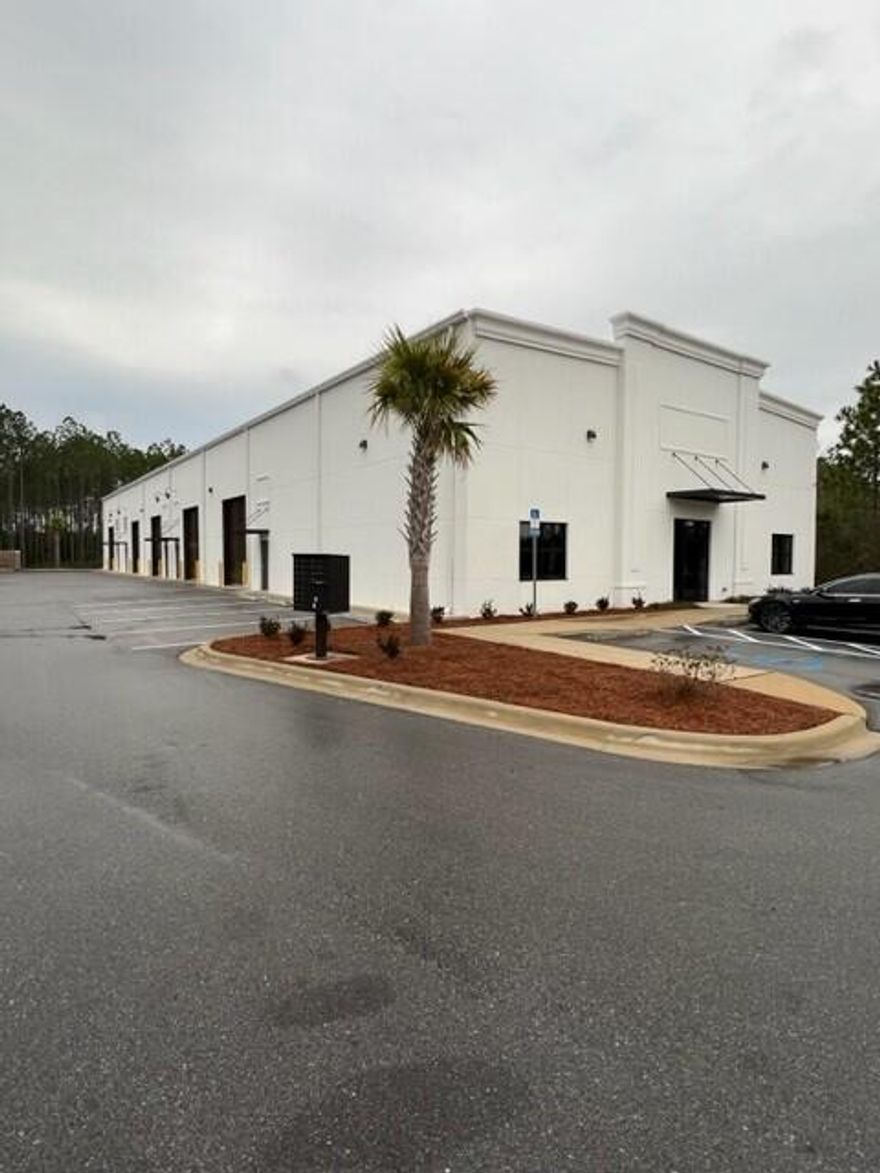 End Cap with storefront glass and doors, fully heated and cooled space with offices, 2 bathrooms and 1,500 sq ft of office and 2,500 sq ft of warehouse space with electric roll up door.