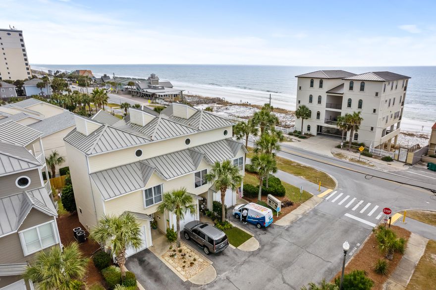 Sweeping Gulf views from this 3-story townhome from both the second and third-floor balconies. Deeded, gated beach access is directly across the street from this updated unit. Inside, the home has been impeccably maintained with new paint, cabinets, and countertops.   Each of the three bedrooms has an attached bathroom, and the primary bedroom is located on its own floor with a walk-in closet, ensuite bathroom, private balcony, and stunning Gulf views. This is the perfect home for short term rental, second home, or full-time residence.   The Low HOA dues covers all landscaping, trash, gated beach walkover, and a community pool. Your dream beach life starts here - don't let it pass you by. All information contained herein is deemed reliable but not guaranteed.