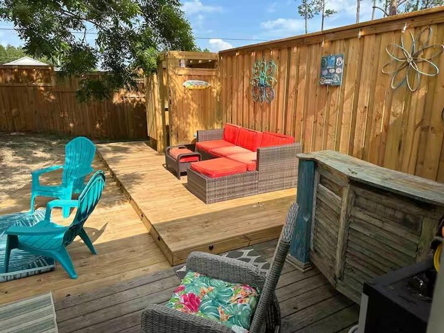 Enjoy exceptional outdoor living with a private deck ideal for relaxing or entertaining, an outdoor shower for easy beach-day rinses, a new paver driveway, and a privacy fence enhancing the backyard space. This single-story 2-bedroom, 2-bath townhome offers ground-floor living, with each bedroom featuring its own private full bath. Located minutes from Scenic Highway 30A and approximately three miles to Gulf beaches, with convenient access to dining, biking paths, and Grand Boulevard. Low annual HOA of approx. $600 annually,  includes lawn care and exterior pest control. Short-term rentals permitted per association guidelines. Buyer to verify all information.Schedule a showing soon, this one won't last long!