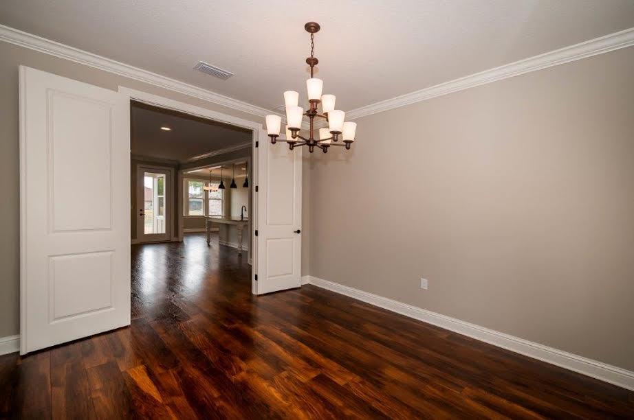 The Willow Oak plan has 2,498 square feet, four bedroom, plus a flex room and 3 baths. Brick exterior, low E-vinyl windows, covered rear porch and a 2 car garage. Interior finishings include, 9' ceilings, granite counter tops, laminate, tile and carpeted floor coverings, crown molding, cased windows and openings. Fence included!! Natural gas range and Rannai tank water heater. Stainless Frigidaire appliances, WoodHarbor cabinets with 100 year finish warranty, tiled shower and tub deck in master and bath 2. Additional upgrades include over sized fridge/freezer, floor plug in living room, ceiling fan on back porch, sink in laundry room with upper and lower cabinets, oil rubbed bronze package and blinds. Hammock Bay offers a clubhouse, movie theater, pools, workout facility, nature trails.