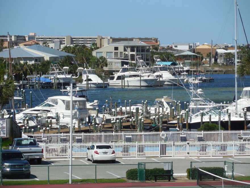 HUGE PRICE REDUCTION-Furnished condo in Sandpiper Cove resort located in the heart of Destin Florida. This condo is updated with new carpet and granite counters. It features awesome views of the marina harbor, an open living & dining room arrangement that adds to spaciousness. Light flows in from windows and a large deck. Located only a quick walk from the deeded 1100 feet of beach access. Sandpiper Cove resort offers amazing amenities such as a private beach club, no external maintenance, a nine hole pitch and putt golf course, 5 swimming pools (2 heated), 3 hot tubs, harbor front marina, boat docking along canal, boat launch, 24 hour gate, courtesy patrol.VRBO Rentals $25k.Covered reserved parking for 2 cars or a car and boat trailer plus storage and more. Call agent to see it
