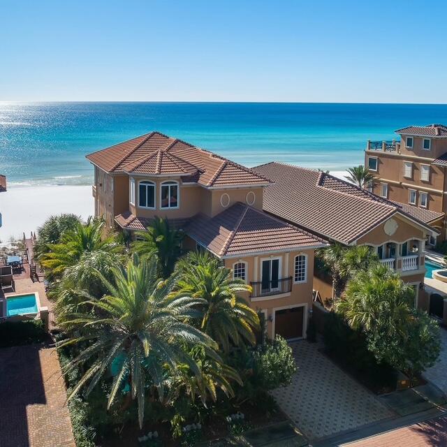 Welcome to 4754 Ocean Blvd, a breathtaking Gulf-front retreat in the exclusive Destiny by the Sea community. This 7-bedroom, 6.5-bathroom masterpiece offers unparalleled views of the emerald waters, a private pool and  beach walkover, and luxurious amenities that redefine coastal living. Step inside to an elegant open-concept design featuring floor-to-ceiling windows, allowing natural light to illuminate the designer finishes and high-end craftsmanship throughout. The chef's kitchen boasts a premium gas range, Sub-Zero refrigerator, custom cabinetry, and a spacious island, perfect for entertaining. The expansive Gulf front balconies provide a front-row seat to the most stunning sunsets, while the private heated pool offers a serene escape just steps from the sugar-white sands. The main living area occupies the south portion of the first floor and is positioned to take full advantage of the sweeping gulf views.  The gulf front dining area is adjacent to the living room which features a media console, gas fireplace, and a wet bar which all flow seamlessly to the covered balcony which spans the length of the home offering stunning gulf vistas and ample lounge space.

Retreat to the primary suite, a true sanctuary with a spa-like ensuite bath and private terrace overlooking the waves with 180 degree water views.  The master is well equipped with an oversized walk-in closet, sitting area, media center, dual vanities, soaking tub, spacious shower, and laundry center.  There are also five luxurious guest suites for the enjoyment of family and friends.  Additionally, there is a stunning office with gulf views that is currently being utilized as a another bedroom.  For convenience and comfort, the home is equipped with an elevator and the 2-car garage provides ample storage and parking.

For entertainment, this home features a state-of-the-art movie room and multiple lounge spaces designed for relaxation. Also, there is a well outfitted laundry and powder bath on the main level.   Whether you're seeking a primary residence, vacation home, or lucrative rental investment, this estate offers it all.

Located in Destiny by the Sea, a prestigious gated community with 24-hour security, 3,000 feet of private beach, and resort-style amenities, this is coastal living at its finest.  This luxurious escape is secluded yet convenient to the heart of Destin and world class amenities including Legendary Marina, Destin Commons, WholeFoods, as well as local restaurants, boutique shopping, and local entertainment.
