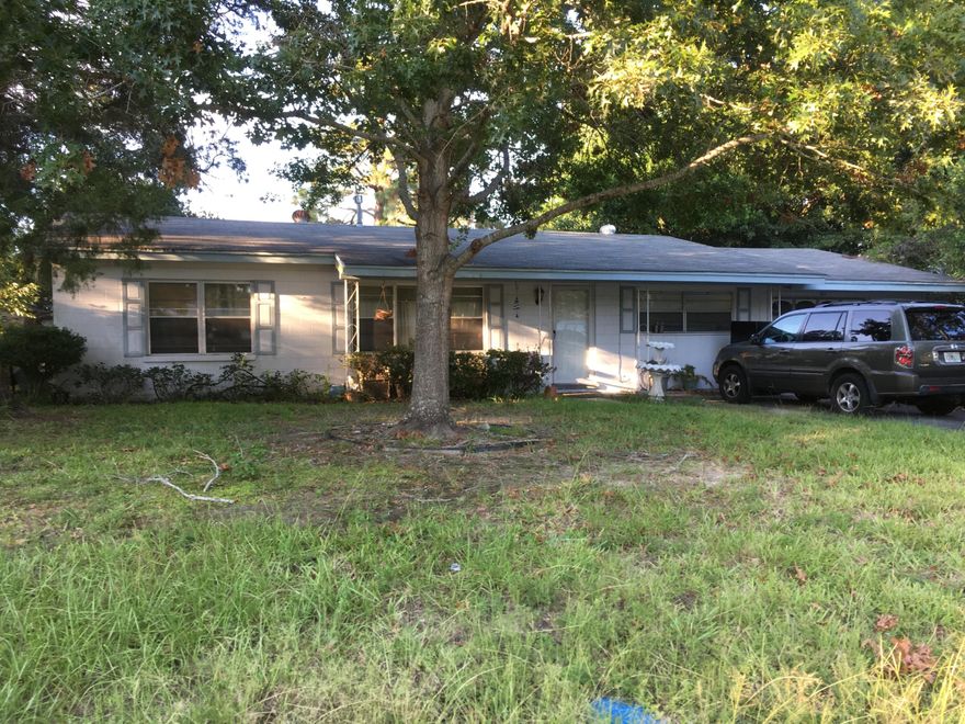 This would be a great starter home. With some TLC you can make this your own. Nice hardwood floors. Open kitchen floor plan with plenty of storage. Master bedroom is large enough for a king size bed and has its own bath with double vanities. Extra deep separate garage with room for a workshop. Large yard provides privacy. Buyer to verify all pertinent information including square footage and lot dimensions. Property to be sold as is.