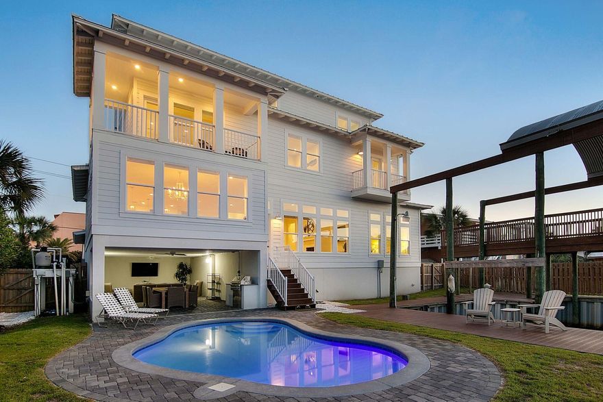 Amazing canal views and convenient deeded beach access on Destin's Holiday Isle make this incredible home the ultimate retreat for boaters who love the beach. This newly constructed three-story property sits just across the street from the sand on famed Gulf Shore Drive and backs up to a canal that leads to the Destin Harbor and ultimately to the Gulf. Two covered deep water boat slips, an oversized grilling area, and a heated pool make outdoor Florida Living effortless. Concrete and steel construction ensure that his trophy home is built to last. High-end appointments on the interior include $100k worth of brand new designer furnishings, reclaimed wood flooring, custom gourmet kitchen with all Thermador appliances, marble countertops, and more. Currently offered as a vacation rental,