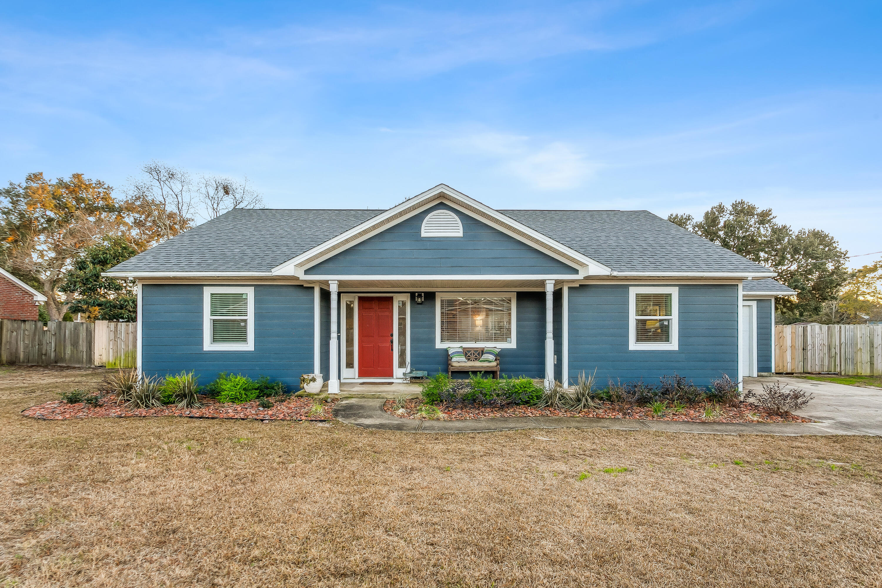 Enjoy amazing amenities for one of the lowest price points available in Holley By The Sea. Great updates to this 3 bedroom, 2 bathroom home that include a new roof, new dishwasher, new windows, new flooring, outside trim replaced with Hardy Board and newer HVAC. Split floor plan with Primary bedroom with primary bathroom that has double vanities, large walk in closet, tile flooring and shower. The living room has a fireplace and plenty of natural light. The other side of the home has two additional bedrooms with a full bathroom. The kitchen/dining area has a breakfast bar, double oven, pantry and laundry area with shelving. Back double doors open up to a covered patio with a huge backyard with a privacy fence. Perfect for enjoying time outdoors or entertaining.