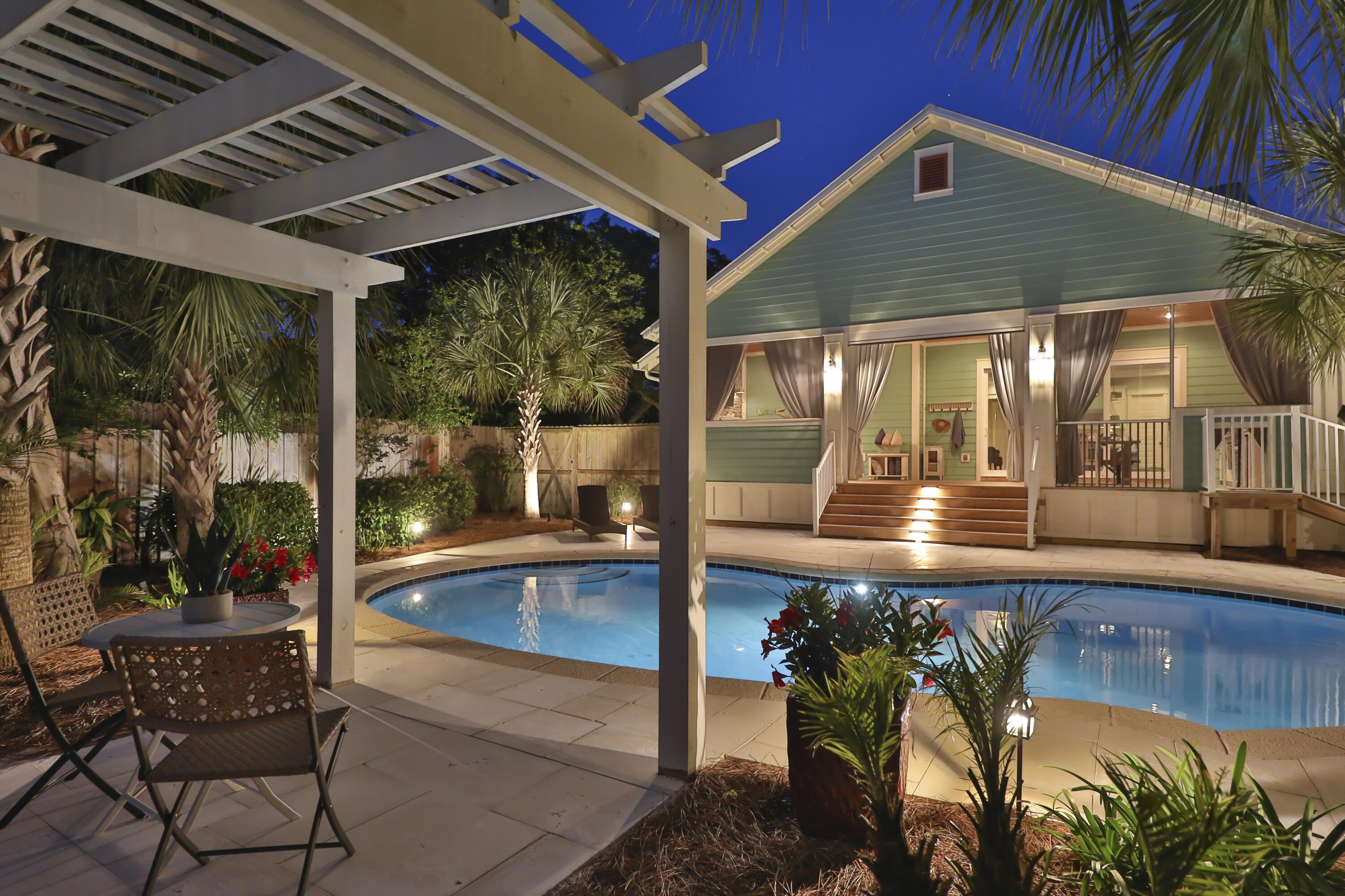 Beautiful North Inlet Beach! This gorgeous property sits on almost a 1/2 acre. All one level, open floor plan, living room opens to a screened in porch with an outdoor gas fireplace and outdoor kitchen that opens to your very own private, heated saltwater pool. Three bedrooms and two bath with a two car detached garage that is heated and cooled, so could easily be converted into an apartment/carriage house. Exterior has been freshly painted. The entire property is fenced in, complete with an electronic driveway gate. No HOA, this home has never been rented, but short term rentals are allowed. Rental projections are $82k-$87k. This beautiful property is perfectly positioned between Lake Powell and the Gulf of Mexico. All information is deemed correct, but please verify if important