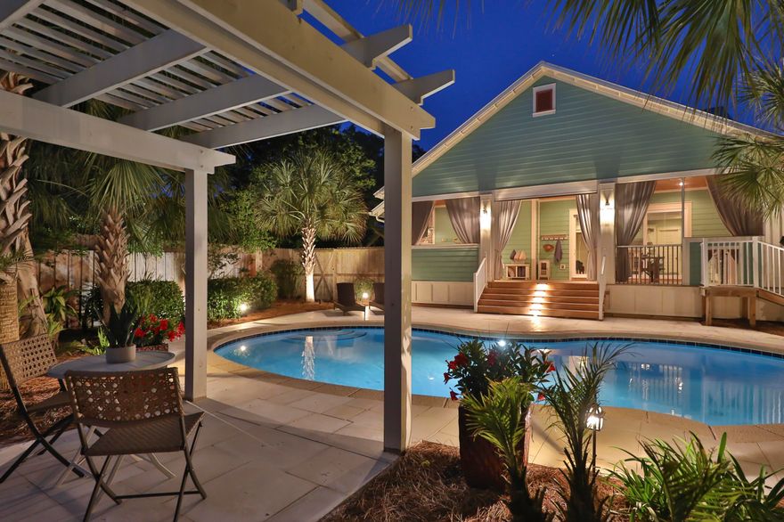 Beautiful North Inlet Beach! This gorgeous property sits on almost a 1/2 acre.  All one level, open floor plan, living room opens to a screened in porch with an outdoor gas fireplace and outdoor kitchen that opens to your very own private, heated saltwater pool.  Three bedrooms and two bath with a two car detached garage that is heated and cooled, so could easily be converted into an apartment/carriage house. Exterior has been freshly painted.  The entire property is fenced in, complete with an electronic driveway gate.  No HOA, this home has never been rented, but short term rentals are allowed. Rental projections are $82k-$87k. This beautiful property is perfectly positioned between Lake Powell and the Gulf of Mexico. All information is deemed correct, but please verify if important