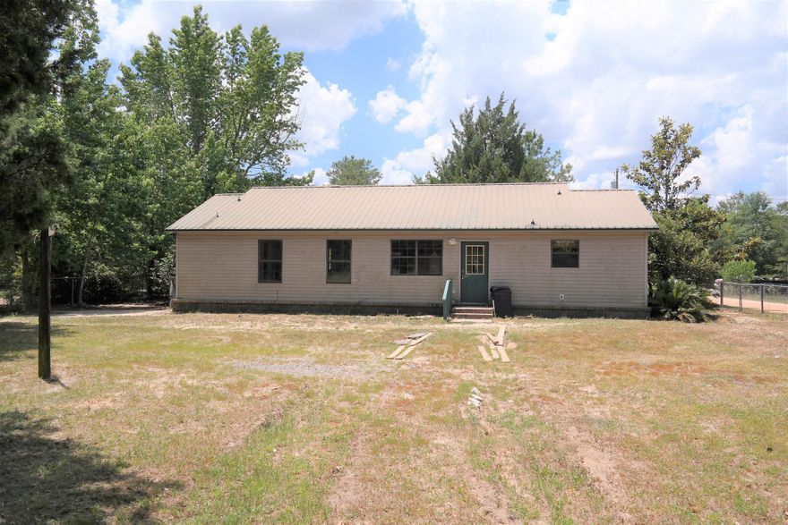 REDUCED FOR QUICK SALLE!! This 3 BR, 2 Bath home on almost 1/2 acre on paved road, with fenced yard, is located in a great location off Rock Hill Rd between Defuniak Springs and Freeport and is apx. 30 minutes from Panama City Beach and the Beaches of S Walton! The home needs a little TLC but is in overall good condition. Master BR has large walk-in closet; Master bath double vanities; generous laundry and pantry. Entire yard is fenced. Schedule your showing today!