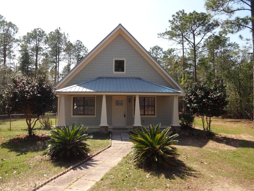 Complete renovation from interior to exterior to roof! A-frame Craftsman style home features an open kitchen, living and dining area. High ceilings with exposed beams add character to this lovely home. Two bedrooms and a bath are located on the first floor and a third bedroom with bath on the second floor. All new flooring, kitchen cabinets, counters, and stainless appliances. Both baths are completely renovated. Bedrooms have new carpeting and abundant natural light. Lot is nearly an acre and home convenient to Bob Sikes Road and Highway 90. Fenced back yard and detached storage shed. Home is turnkey and ready for a new owner!