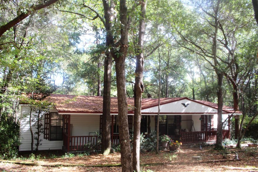 Private retreat close to town...as you come down the driveway, you will feel as if you've made it to the countryside. Mature trees and bushes, large front porch and rear deck as well as a spacious Florida room. Inside the home, you will find a fireplace, kitchen equipped with appliances and a separate dining room. Washer and dryer will also convey. RV parking to the far side of home, a basement workshop and metal roof. Buyer to verify all areas of importance included but not limited to zoning, sq footage, lot size/dimensions, etc...