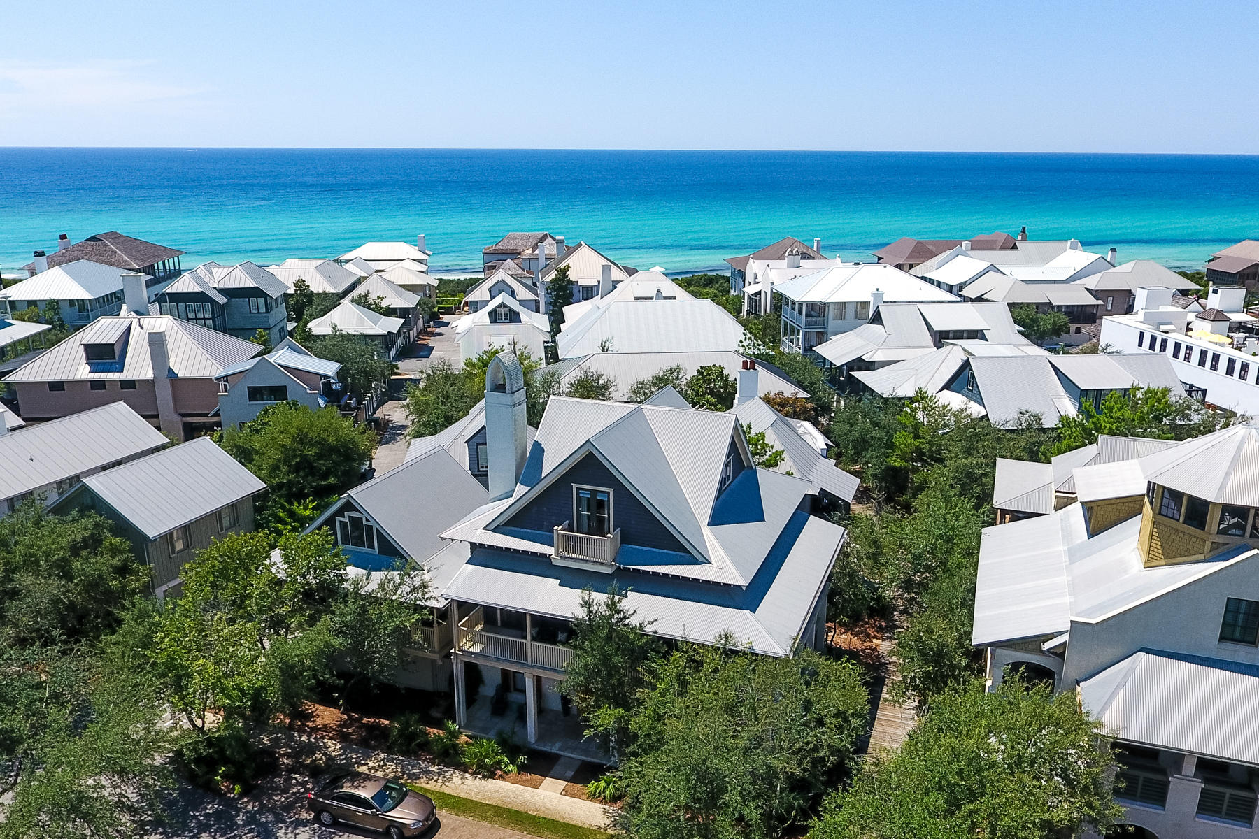 Nestled in the heart of Rosemary Beach, near the Town Center and a short walk to the beach, resides a recently updated 5 bedroom, 3 -1/2 bath main house, with 1 bedroom, 1 bathroom carriage house with loft. The open floor plan was designed on a grand scale, with entertaining and large families in mind. The ground floor consists of four bedrooms ideal for guests and children. Upstairs, the second level boasts an oversized family room with dining area and gourmet kitchen with professional stainless steel appliances, granite countertops and breakfast bar. A private master suite on the third floor opens to an outside balcony, a perfect location for soaking in the sun or enjoying the ocean breeze.