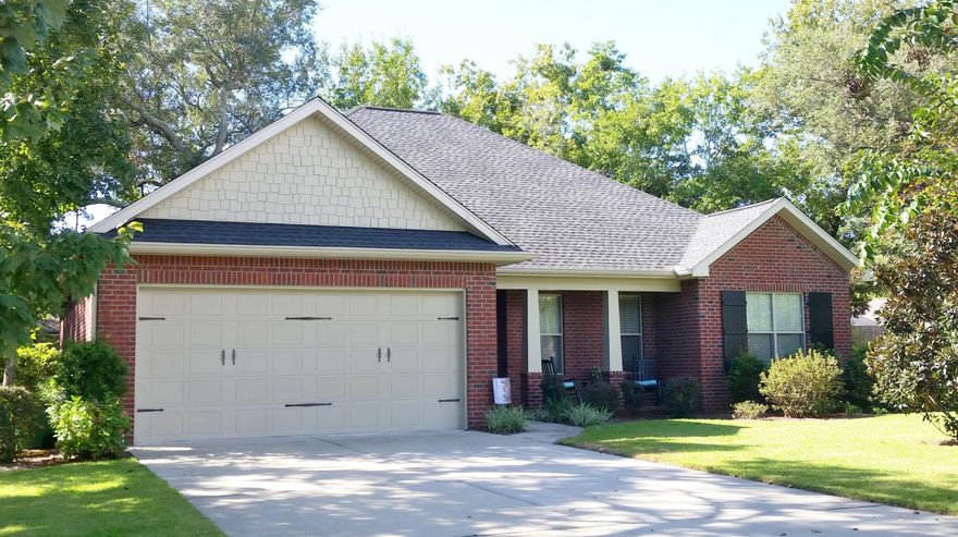 There's no place like Home! This one walked off a page of Southern Living! The ONLY home in this subdivision to INCLUDE a whole additional LOT, giving nearly half an acre to build your dream pool or outside oasis! Enter into high ceilings with 8 foot doors throughout. Tons of storage with kitchen boasting 2 pantry's, stainless steel appliances, 42'' upper cabinets, breakfast bar, and decorative subway tile backsplash. Open to the Dining area, floor plan flows into the living room with crown molding, and doors to screened porch. The master is spacious and master bath features luxurious tiled shower with seat, private water closet, double vanities, and HUGE walk in closet. Hall bath has double vanities. Additional bedrooms are large and welcoming. Warm wood flooring with tile in wet areas,