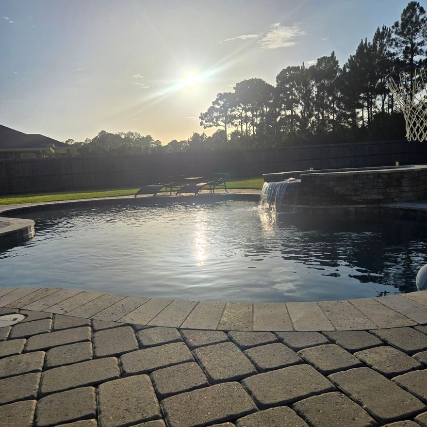 Another jackpot in Florida!  These 'winners' on Nevada St in Navarre can't be beat.  Play your hand right and this backyard oasis can be yours.  The oversized patio covered with your pergola makes it the perfect retreat to feast on the backyard barbeque after you've been swimming in your saltwater pool and basking in your hot tub all day.    This near half acre property allows you to host the best of the best.  Water activities, croquet with the family that's gonna visit you, cause you're only 5 minutes from these gorgeous beaches.  And they know with the split floor and the flex room, they will be able to sleep comfortably in this spacious house as well.   I 'bet' when you see it you're gonna want it.   The lounge chairs are waiting, and there are cold drinks in the fridge.
