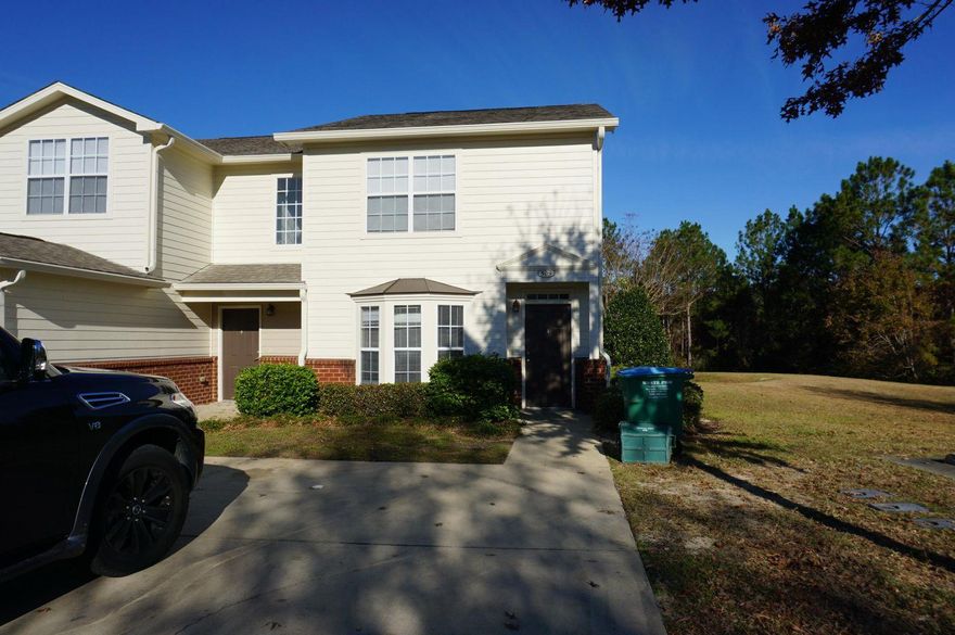 Wonderful end unit town home with easy access to bases, beaches, and shopping. Unit features fenced patio, laminate fooring and ceramic tile throughout, 2 bedrooms and 2.5 bath floor plan. Galley kitchen, downstairs storage under the stairs, down stairs laundry closet, exterior storage closet, open back patio and upgraded lighting. Unit boasts large parking pad for two vehicles. Two master suites with both bedrooms being upstairs and large walk in closets.