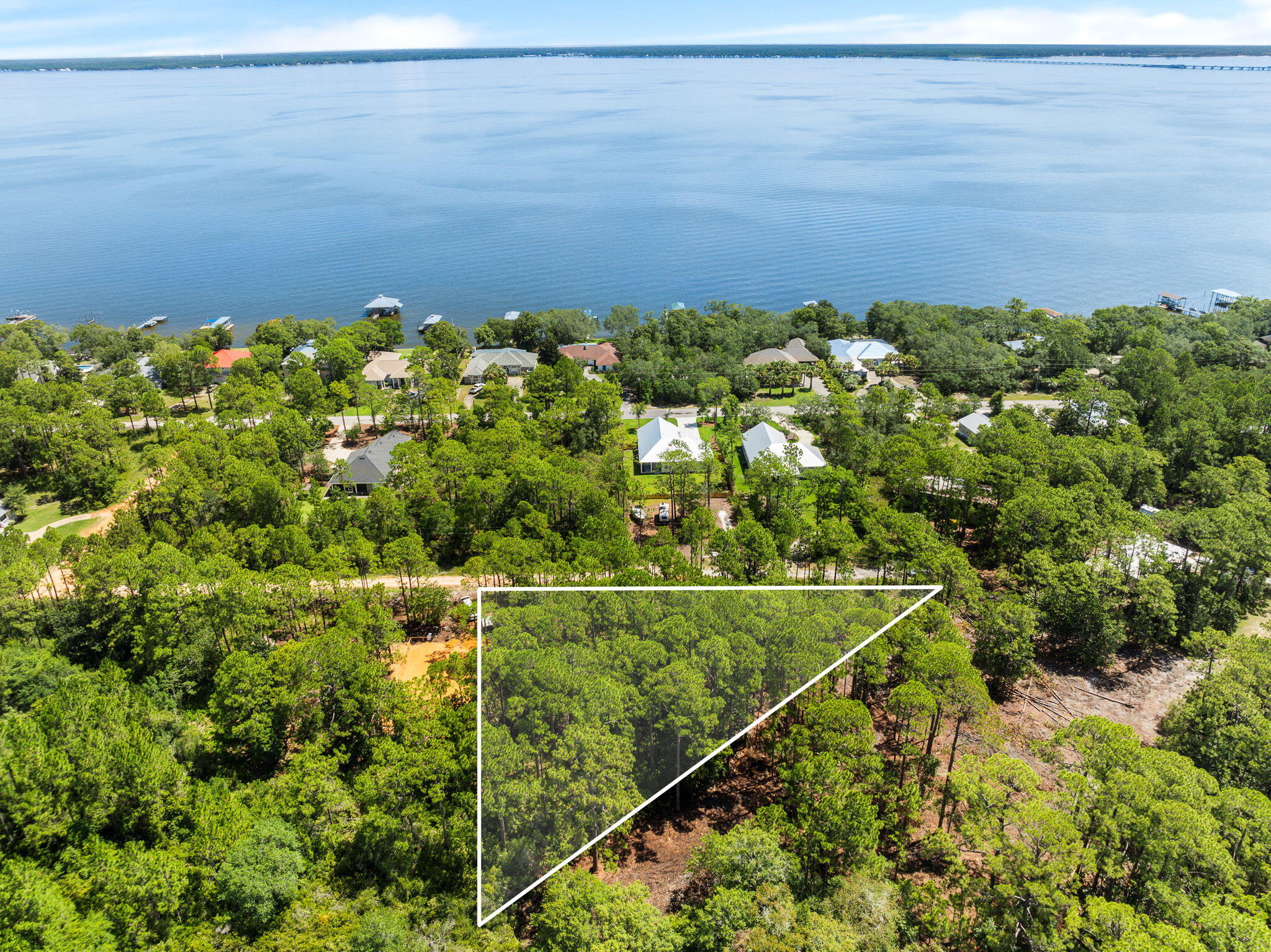 An incredible opportunity with NO HOA is now available to build your dream home in a highly desirable area in Santa Rosa Beach!This vacant lot, ready to build, presents an exceptional canvas for your dream retreat. The property sale includes home building plans for a 2,714 SF home with a 2-car garage. The home includes 3 bedrooms, 2.5 bathrooms, 2 oversized porches, his/her closets, and many more well thought out details to make this home ideal for any buyer.This homesite is convenient to a boat launch, Kellogg Park, with access to both the Choctawhatchee Bay and the beautiful white sand beaches of the Gulf Coast.The combination of privacy, location, shopping, and dining makes this homesite an ideal choice for constructing your beach getaway. Imagine yourself living in thi community filled with hundred year old oak trees and just minutes away from the World's most beautiful beaches!
Make this beautiful homesite yours TODAY! Buyer to verify all information.