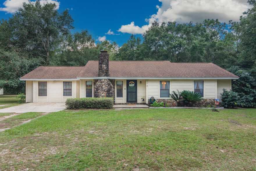 BACK ON MARKET DUE TO NO FAULT OF SELLER. Conveniently located on a spacious one acre lot, this 4 Bedroom, 2 Bathroom home offers 1600 square feet of living area. There is a spacious breakfast bar separating the living room from   the  galley style kitchen and a  4th bedroom located off the living room could also serve as a family room.  Master bedroom has a sliding glass door that leads  to back patio. Chain link fencing in back yard. Water heater replaced October 2021, HVAC system replaced June 2020, septic and drain lines replaced May 2016. At list price & acceptable terms, Seller will escrow funds at closing towards new roof and electrical panel change out.  Stone fireplace does not function as a wood burning fireplace and will convey as-is, aesthetic feature only.  Low county taxes!