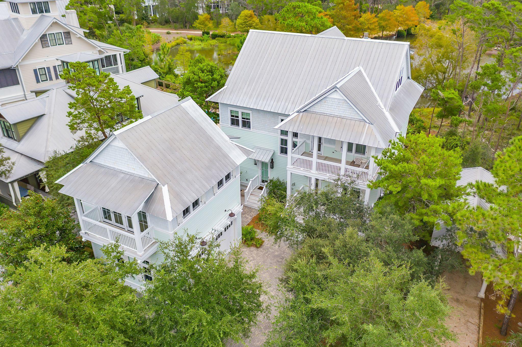 A charming light filled coastal retreat! Situated on a large lot in Phase III of WaterColor this 3 level home boasts 4,907 square feet, 6 bedrooms, and 6 1/2  bathrooms backing to nature preserve. An incredibly inviting home from the minute you walk in the door from the soaring ceilings to endless brightness and dazzling beach decor. Truly an entertainers dream with open-concept dining, living and kitchen for seamless entertaining and family get togethers. You will never want to leave after you experience the beautiful sounds of nature from the expansive screened in porch located just off the main living room. Your own private oasis and with incredible views! There is also plenty of room to relax with a cocktail after a day at the beach from the private front porch. This home offers a main