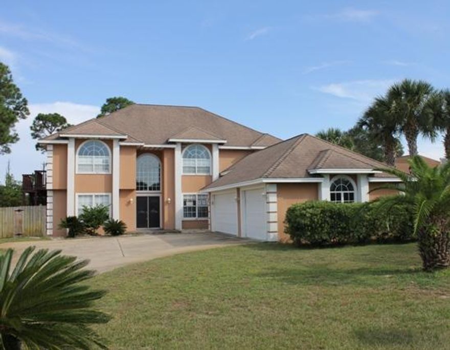 REO ~ Spacious 5 Bd / 3 Ba home in Emerald Pointe... The home offers an open floor plan with huge great room featuring built in book cases, fireplace & hardwood floors. The great room also offers large windows for views of the Santa Rosa sound. The split staircase provides access to the master suite or the second floor bedroom wing. The master suite boasts a double vanity, separate shower & whirlpool tub. The master suite also features its own private balcony. The gourmet kitchen offers granite counter tops, breakfast nook & double oven. Enjoy entertaining by your swimming pool. Don't miss out on all this home has to offer. *The HOA is a voluntary.