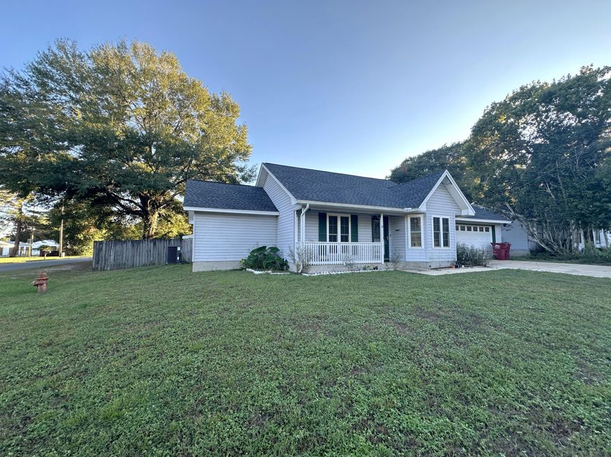 Move-in ready home on a corner lot with major updates completed. New AC (2022), water heater (2023), roof (2023), and windows. Interior features new LVP flooring throughout with tile in the kitchen and bathrooms. The primary suite includes a new walk-in shower, walk-in closet, and access to the backyard. The property sits on a corner lot with a large fenced backyard, a deck, covered patio, and storage shed. A two-car garage provides additional convenience. Located in South Crestview, it offers quick access to I-10.