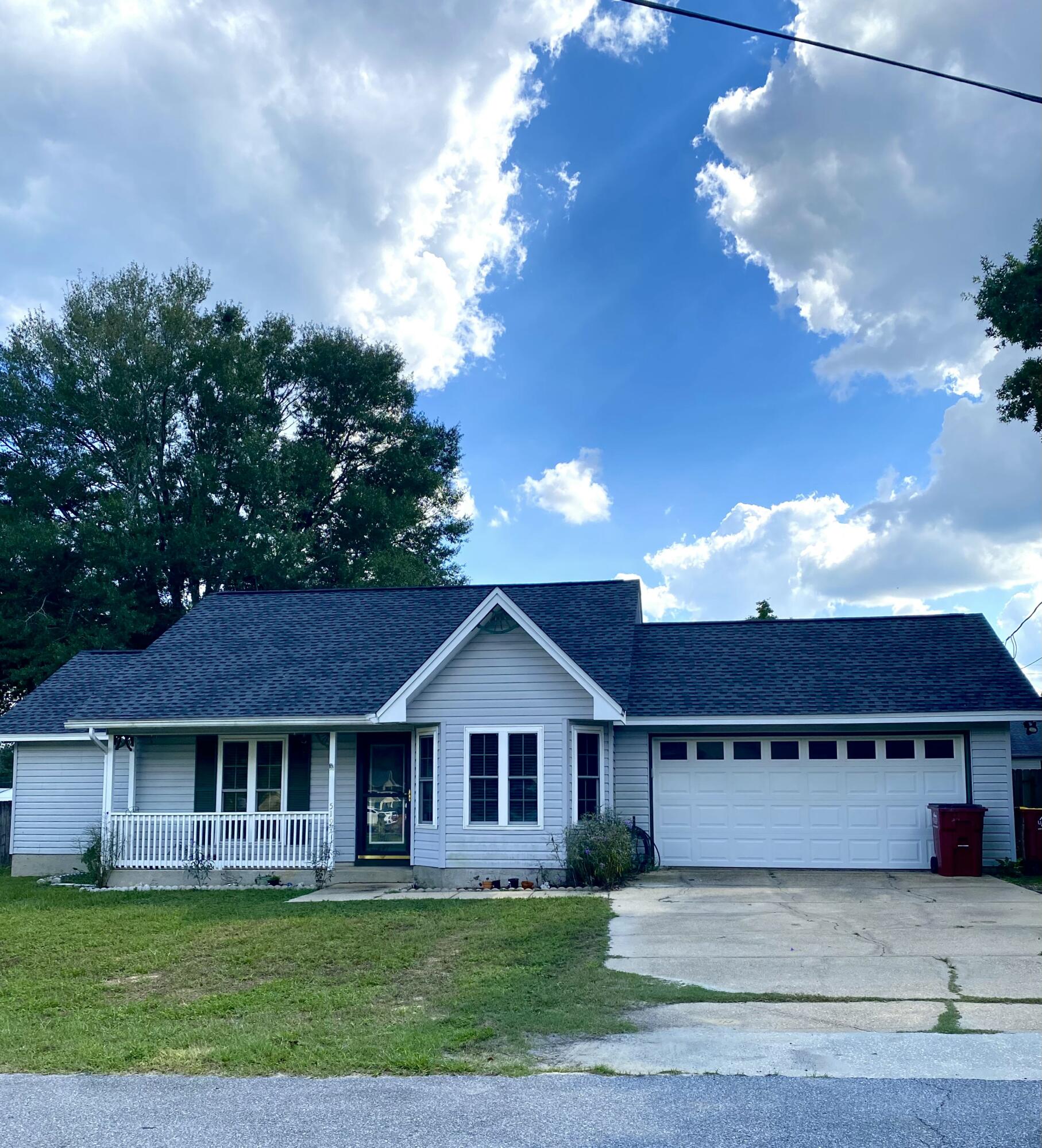 Move-in ready home on a corner lot with major updates completed. New AC (2022), water heater (2023), roof (2023), and windows. Interior features new LVP flooring throughout with tile in the kitchen and bathrooms. The primary suite includes a new walk-in shower, walk-in closet, and access to the backyard. The property sits on a corner lot with a large fenced backyard, a deck, covered patio, and storage shed. A two-car garage provides additional convenience. Located in South Crestview, it offers quick access to I-10.