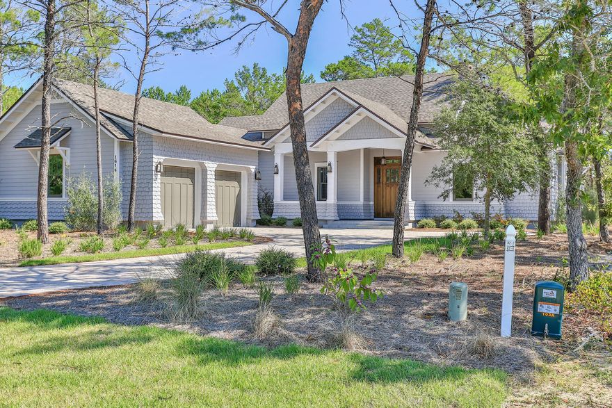 UPON entering the guarded gates of Wild Heron you realize that you truly have entered a ''Coastal Sanctuary''!! The peaceful transition from the hectic, over crowded areas of the beach, is certain to impress you with a feeling of Calm, and a oneness with nature. Nestled on the shores of Lake Powell, and the home to Sharks Tooth Golf Club, Wild Heron sits on 750 Acres of well planned tranquility and fabulous amenities. 1614 Lost Cove overlooks the golf course, through a privacy barrier of mature trees,and given the well planned placement of this home, privacy and view are protected. One story living with a split master bedroom, Open living, kitchen, and dining opening to generous covered porches. Hardwood floors. Fabulous home!